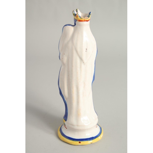 1194 - A MAJOLICA POTTERY FIGURE 