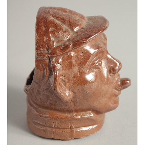 1195 - A SALTGLAZE HEAD OF A BOY. 4ins high.