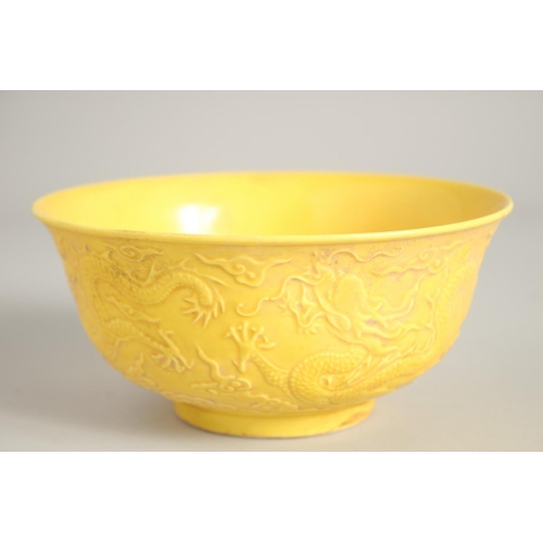 1209 - A CHINESE FAMILLE JAUNE CIRCULAR RICE BOWL, dragons in relief.