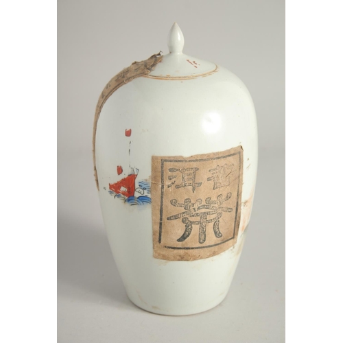 1214 - A CHINESE PORCELAIN TEA JAR AND COVER. 9ins high.