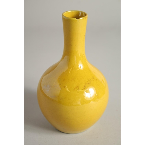 1218 - A CHINESE YELLOW PORCELAIN VASE. 7ins high.