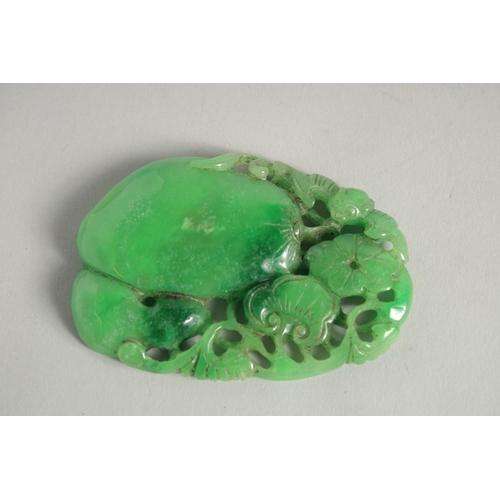 1229 - A CHINESE CARVED LARGE JADE PENDANT. 3ins.