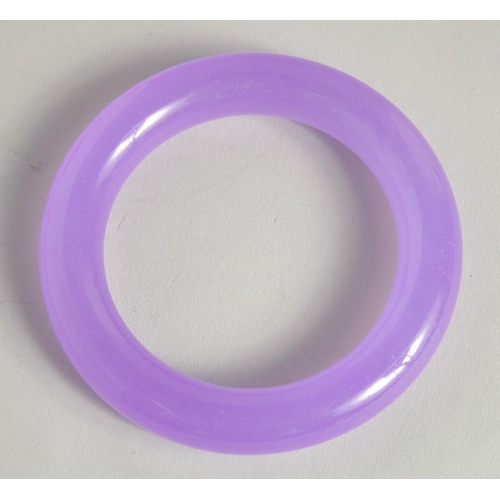 1230 - A LILAC JADE BANGLE. 3.25ins diameter.