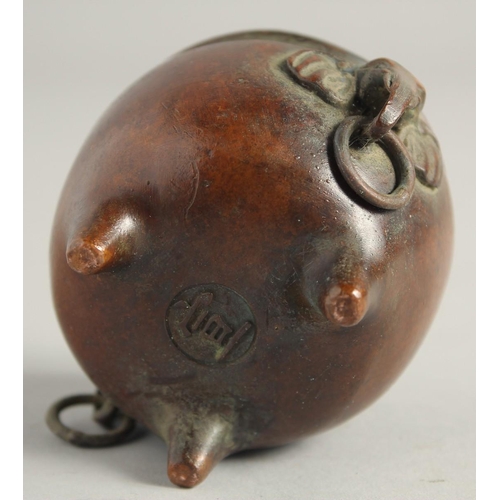 1240 - A SMALL CHINESE BRONZE CIRCULAR CENSER with elephant handles. 2.25ins diameter.