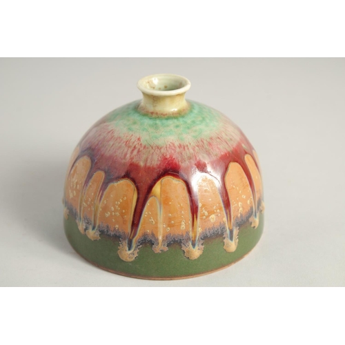 1242 - A CHINESE DRIP GLAZE CIRCULAR PORCELAIN BEEHIVE BRUSH POT. 4.5ins diameter.