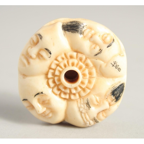 1243 - A CHINESE CARVED BONE NETSUKE. 1.5ins diameter.