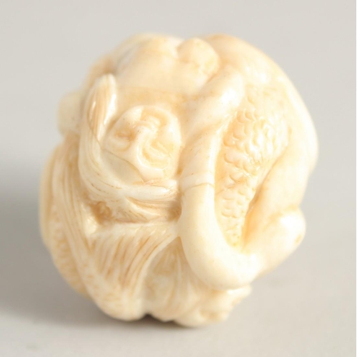 1244 - A CHINESE CARVED BALL NETSUKE 