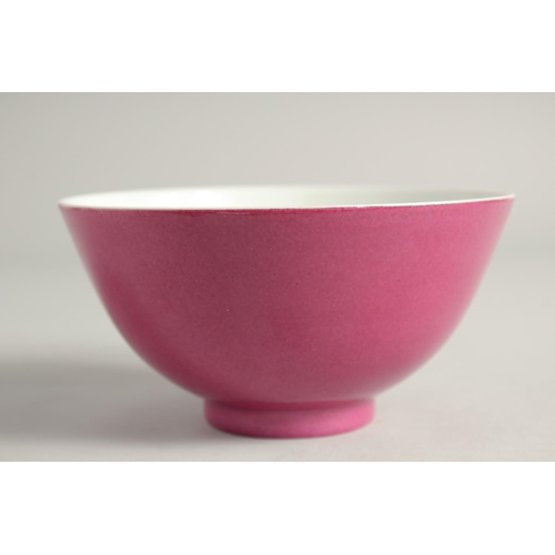 1248 - A CHINESE PINK GLAZE PORCELAIN BOWL six character mark to base, 14cm diameter.