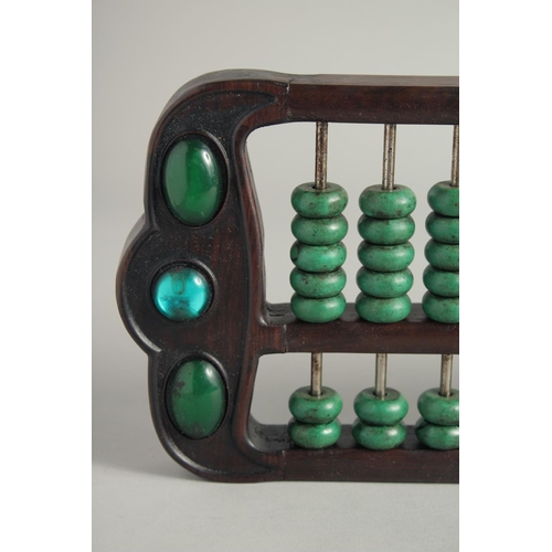 1249 - A CHINESE TURQUOISE BEADED HARDWOOD ABACUS.