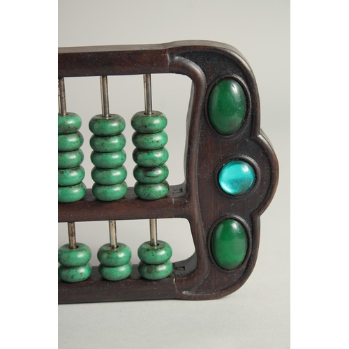 1249 - A CHINESE TURQUOISE BEADED HARDWOOD ABACUS.