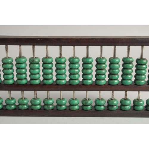 1249 - A CHINESE TURQUOISE BEADED HARDWOOD ABACUS.