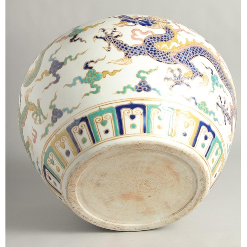 1250 - A VERY LARGE CHINESE SANCAI PORCELAIN JAR, decorated with dragons beneath a band of lotus and scroll... 