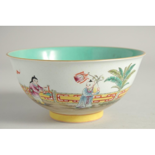 1252 - A CHINESE FAMILLE ROSE PORCELAIN BOWL the interior with turquoise glaze. 17cm diameter.