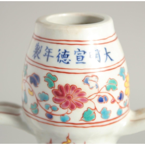 1253 - A CHINESE WUCAI PORCELAIN TWIN HANDLED MOON FLASK decorated with a central dragon. 29cm high.