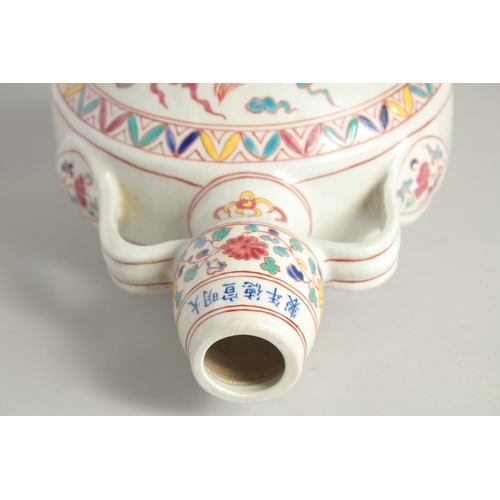 1253 - A CHINESE WUCAI PORCELAIN TWIN HANDLED MOON FLASK decorated with a central dragon. 29cm high.