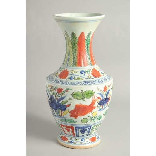 1255 - A LARGE CHINESE WUCAI PORCELAIN VASE painted with fish and algae. 38cm high.