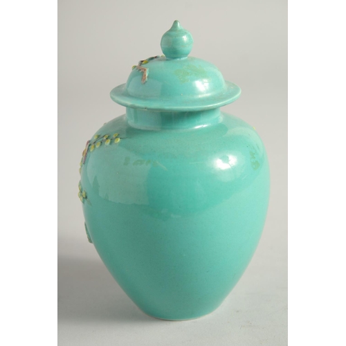 1258 - A SMALL CHINESE TURQUOISE GLAZE JAR AND COVER.