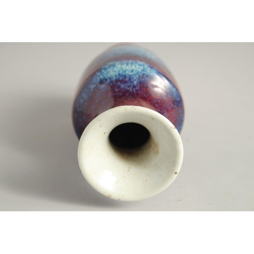 1261 - A SMALL FLAMBE STYLE GLAZE PORCELAIN VASE. 15.5cm high.