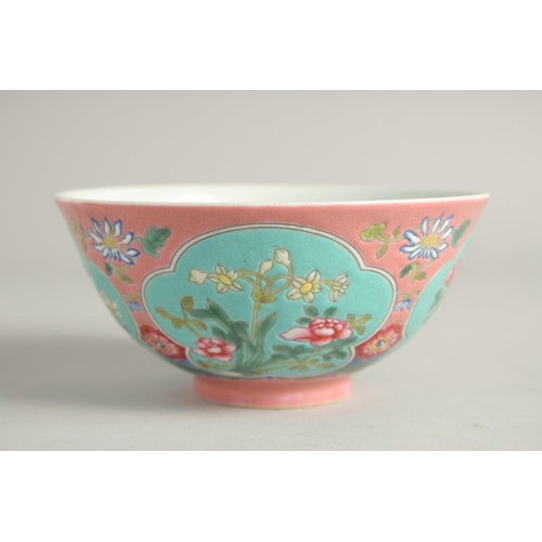 1265 - A CHINESE FAMILLE ROSE PORCELAIN BOWL, decorated with turquoise panels of native flora. 15ins diamet... 