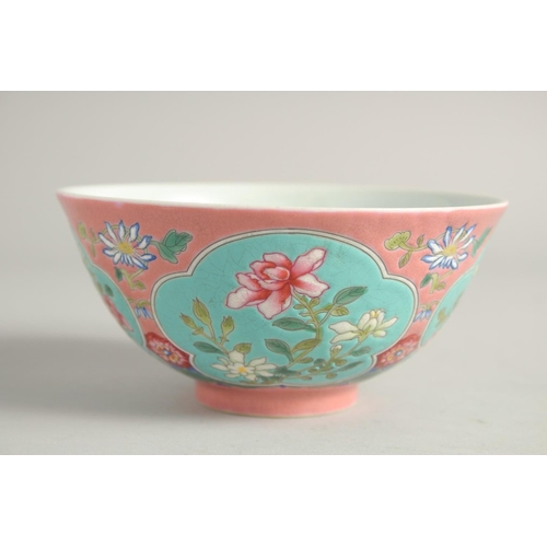 1265 - A CHINESE FAMILLE ROSE PORCELAIN BOWL, decorated with turquoise panels of native flora. 15ins diamet... 