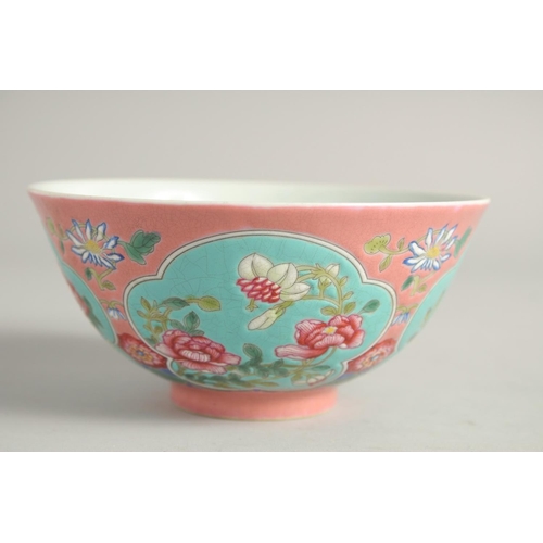 1265 - A CHINESE FAMILLE ROSE PORCELAIN BOWL, decorated with turquoise panels of native flora. 15ins diamet... 