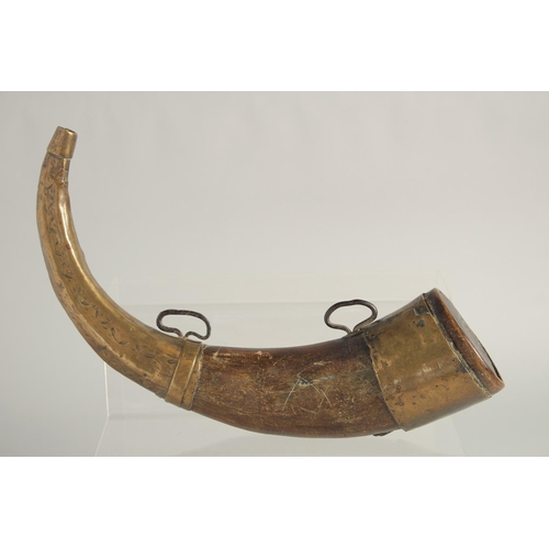 1267 - A BOVINE HORN POWDER FLASK with brass mounts. 28cm long