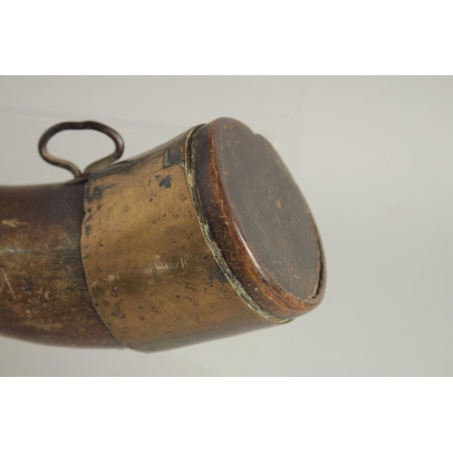 1267 - A BOVINE HORN POWDER FLASK with brass mounts. 28cm long