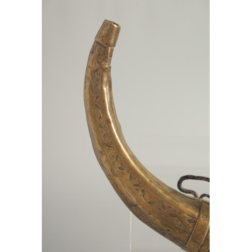 1267 - A BOVINE HORN POWDER FLASK with brass mounts. 28cm long