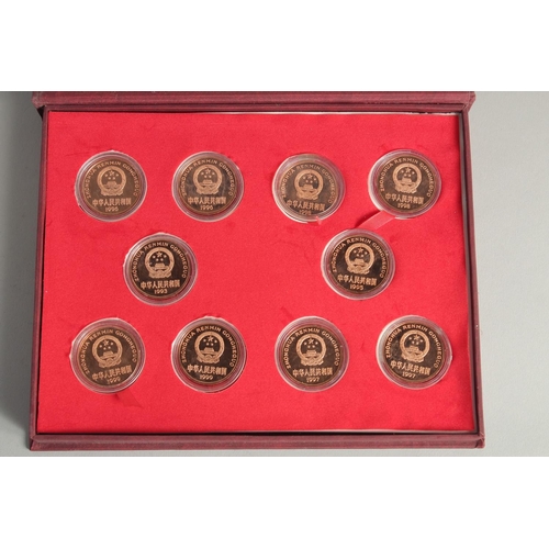 1268 - A COLLECTION OF TEN CHINESE COINS in presentation box.