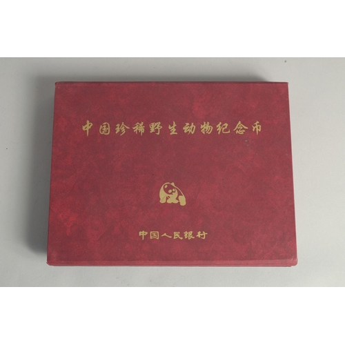 1268 - A COLLECTION OF TEN CHINESE COINS in presentation box.