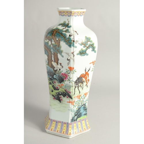 1269 - A CHINESE FAMILLE ROSE HEXAGONAL FORM VASE decorated with deer and cranes in a woodland setting. 38c... 