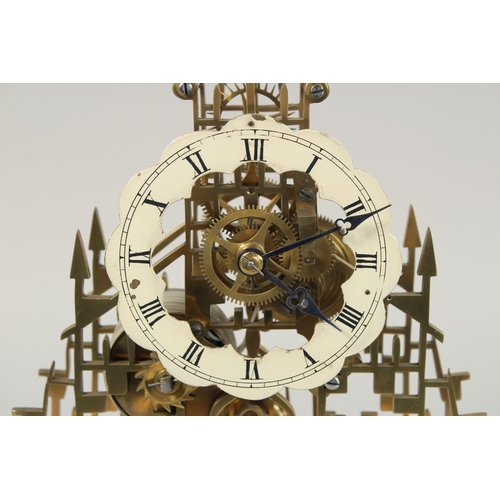 1276 - A GOOD VICTORIAN BRASS CATHEDRAL SKELETON CLOCK with black and white Roman numerals, fusee mount on ... 