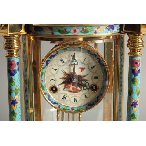 1282 - A GOOD GILT METAL AND CLOISONNE ENAMEL CIRCULAR COLUMN CLOCK with urn finial. 1ft 6ins high.