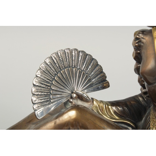 1286 - A VERY GOOD ART DECO BRONZE GROUP OF A LADY SEATED HOLDING A FAN in front of a Borzoi on an inlaid b... 