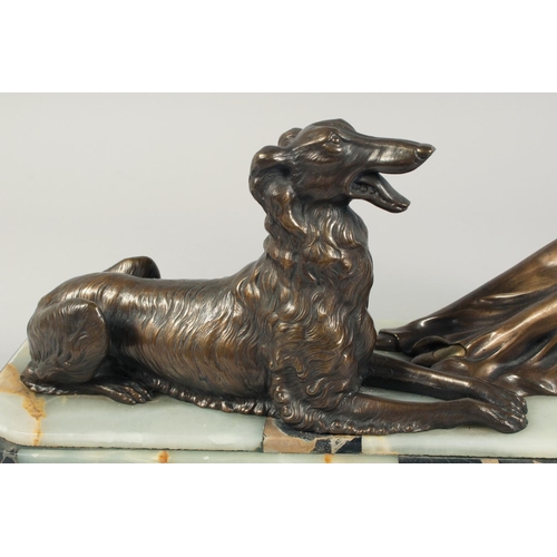 1286 - A VERY GOOD ART DECO BRONZE GROUP OF A LADY SEATED HOLDING A FAN in front of a Borzoi on an inlaid b... 