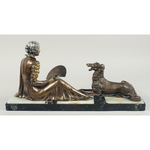 1286 - A VERY GOOD ART DECO BRONZE GROUP OF A LADY SEATED HOLDING A FAN in front of a Borzoi on an inlaid b... 