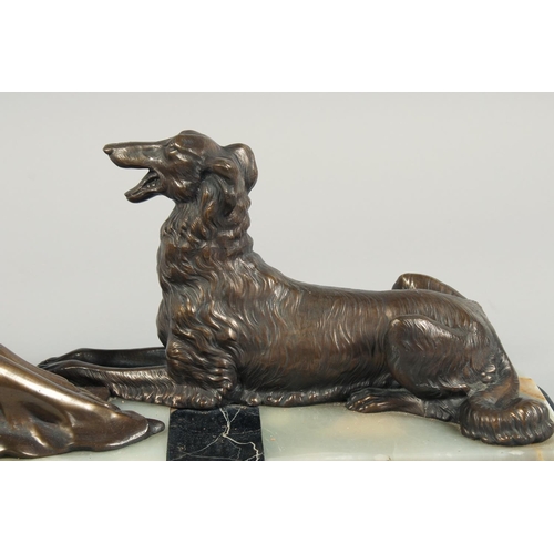 1286 - A VERY GOOD ART DECO BRONZE GROUP OF A LADY SEATED HOLDING A FAN in front of a Borzoi on an inlaid b... 