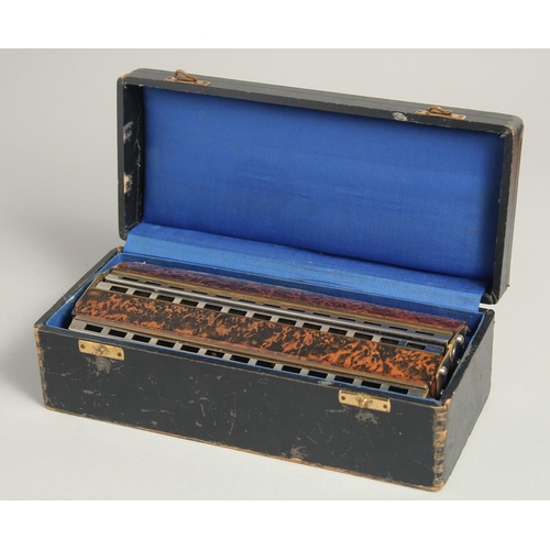 1313 - M. HOHNER. CHROMATIC BOSS HARMONICA. No. 265. 8.5ins long, in a case.