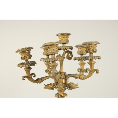 1318 - A GOOD PAIR OF 19TH CENTURY FRENCH ORMOLU SIX LIGHT CANDELABRAS with dwarf figures on a base with ma... 