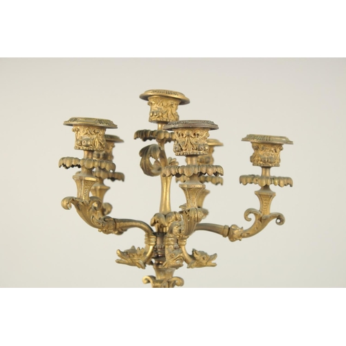 1318 - A GOOD PAIR OF 19TH CENTURY FRENCH ORMOLU SIX LIGHT CANDELABRAS with dwarf figures on a base with ma... 