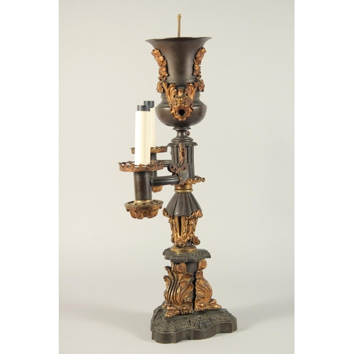 1321 - THOMAS MESSENGER. A REGENCY BRONZE AND ORMOLU TWO LIGHT CANDELABRA with outstretched arms and an urn... 