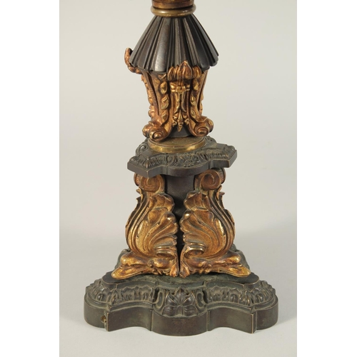 1321 - THOMAS MESSENGER. A REGENCY BRONZE AND ORMOLU TWO LIGHT CANDELABRA with outstretched arms and an urn... 