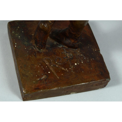 1328 - AFTER DEGAS A BRONZED STANDING FEMALE FIGURE on a square base. 13ins high.