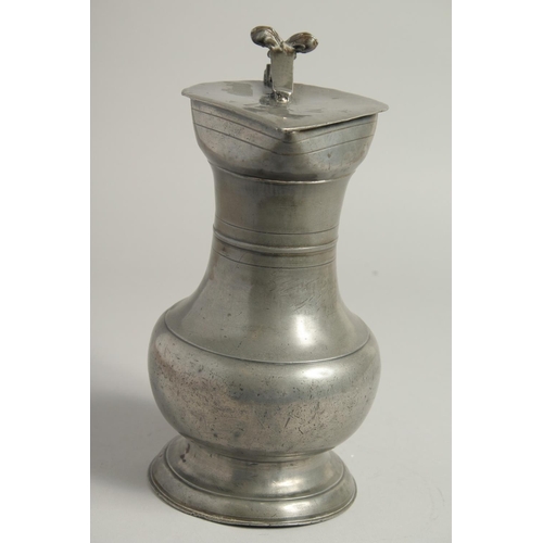 1329 - A GOOD 18TH CENTURY SWISS PEWTER FLAGON AND COVER. 10ins high.