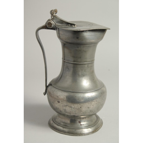 1329 - A GOOD 18TH CENTURY SWISS PEWTER FLAGON AND COVER. 10ins high.