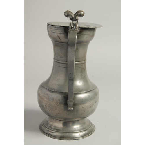 1329 - A GOOD 18TH CENTURY SWISS PEWTER FLAGON AND COVER. 10ins high.