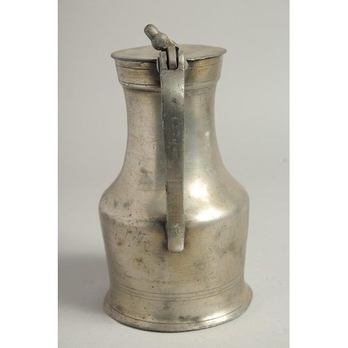 1331 - A LARGE 18TH CENTURY PEWTER JUG AND COVER. 10ins high.