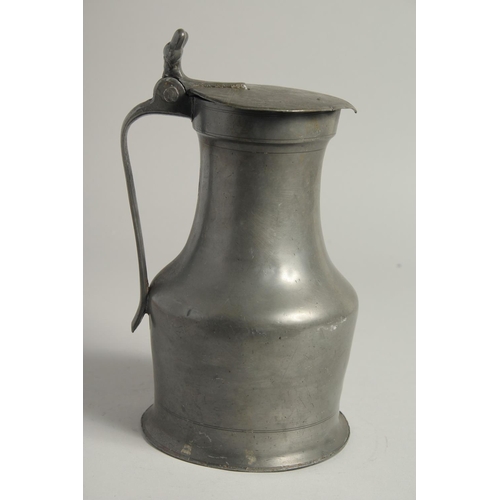 1334 - AN 18TH CENTURY FRENCH PEWTER JUG AND COVER. 10ins high.