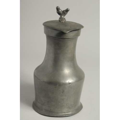 1334 - AN 18TH CENTURY FRENCH PEWTER JUG AND COVER. 10ins high.