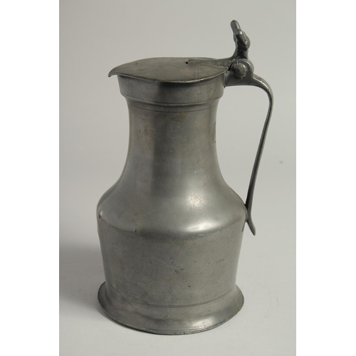 1334 - AN 18TH CENTURY FRENCH PEWTER JUG AND COVER. 10ins high.